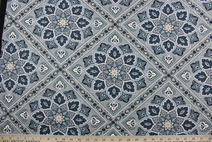 The Richloom Solarium© Medallion in Greystone features a unique geometric medallion print in a palette of grey, blue, and cream tones, making it a perfect choice for any outdoor space.  This versatile, long-lasting fabric can withstand up to 500 hours of sunlight, water and stain resistant and has 10,000 double rubs.  It is perfect for lounge cushions, pool furniture, tablecloths, decorative pillows and upholstery projects.