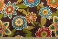 This Richloom© Solarium© Outdoor Annie fabric features a large floral print in vibrant colors including teal, dark red, lemon yellow, burnt orange, tan, olive green, and off-white on a chocolate brown background.&nbsp;It's also stain and water repellant and offers 500 UV hours for long-lasting use.&nbsp; Perfect for lounge cushions, pool furniture, tablecloths, decorative pillows and upholstery projects. <span data-mce-fragment="1">Recommended to store away when not in use.</span>