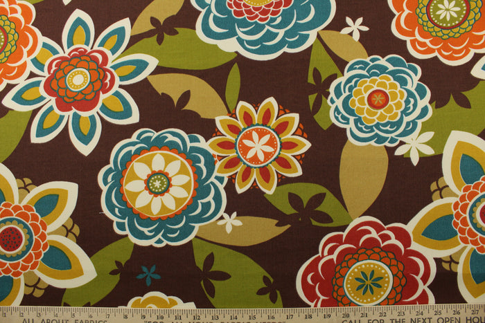 This Richloom© Solarium© Outdoor Annie fabric features a large floral print in vibrant colors including teal, dark red, lemon yellow, burnt orange, tan, olive green, and off-white on a chocolate brown background.&nbsp;It's also stain and water repellant and offers 500 UV hours for long-lasting use.&nbsp; Perfect for lounge cushions, pool furniture, tablecloths, decorative pillows and upholstery projects. <span data-mce-fragment="1">Recommended to store away when not in use.</span>