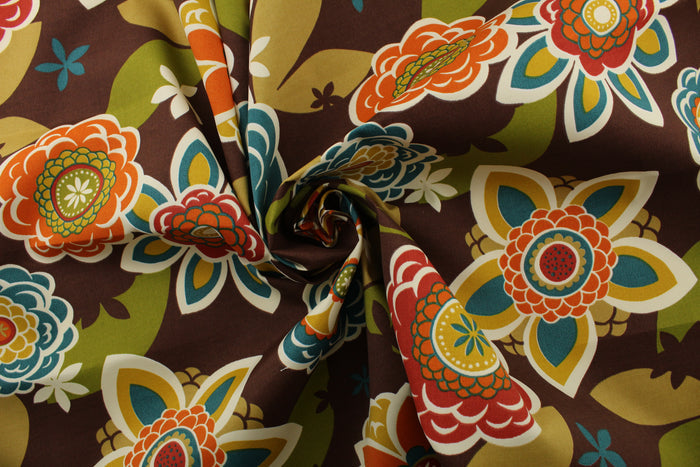 This Richloom© Solarium© Outdoor Annie fabric features a large floral print in vibrant colors including teal, dark red, lemon yellow, burnt orange, tan, olive green, and off-white on a chocolate brown background.&nbsp;It's also stain and water repellant and offers 500 UV hours for long-lasting use.&nbsp; Perfect for lounge cushions, pool furniture, tablecloths, decorative pillows and upholstery projects. <span data-mce-fragment="1">Recommended to store away when not in use.</span>
