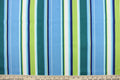 This outdoor fabric features bright stripes in blue, navy blue, lime green, dark green, turquoise, and white.