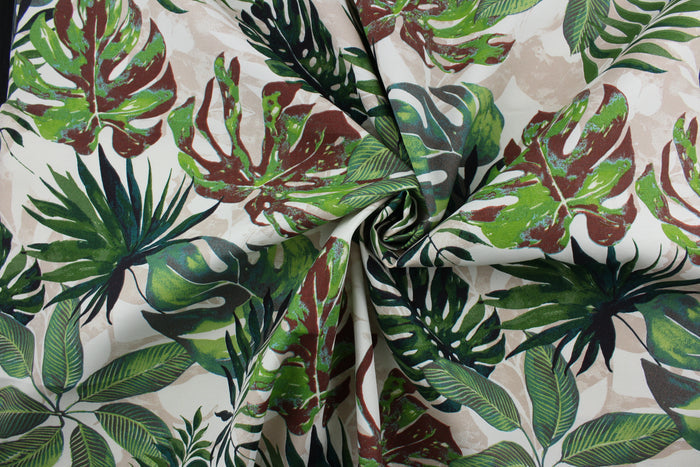 The Richloom Solarium© Piermont in Floral print contains bold, tropical palm leaves in shades of green, beige, black, and brown making it ideal for outdoor multipurpose use.  It has been tested to resist 500 hours of exposure to sunlight.  The fabric is also water and stain resistant.  Perfect for porches, patios and pool side.  Uses include toss pillows, cushions, upholstery, tote bags and more.