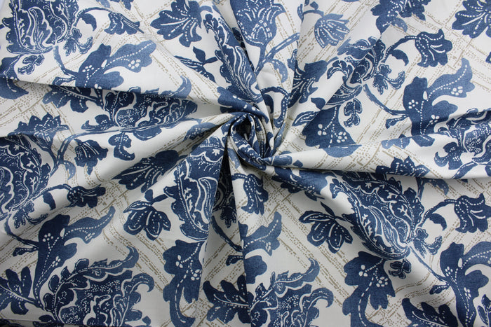 The Robert Allen© Bluebonnet in Indigo features a unique, multipurpose print with geometric and floral motifs that come together in a distinctive indigo blue, gold, and white color palette. It's designed to withstand up to 100,000 double rubs, and is dirt and stain repellant for worry-free use. It can be used for several different statement projects including window accents (drapery, curtains and swags), toss pillows, headboards, bed skirts, duvet covers, upholstery, and more.