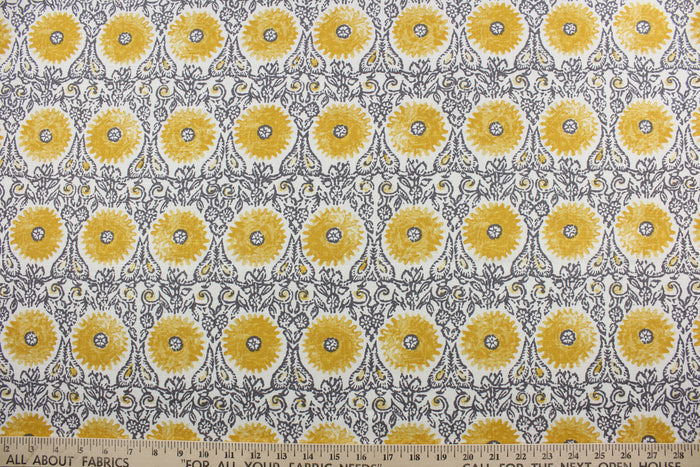 This Robert Allen© Riya in Yellow multipurpose fabric is the perfect choice for your next project. Made of a linen blend, it features an ornamental design in yellow, gray, and white.  Its soil and stain resistance provide an easy-care fabric that looks great for years to come.  It can be used for several different statement projects including window accents (drapery, curtains and swags), toss pillows, headboards, bed skirts, duvet covers, upholstery, and more.