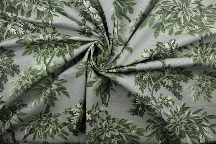 Robert Allen© Sylvan Toile features a beautiful botanical print on a traditional gray background. The vibrant colors of green, black, and white will bring a timeless charm to any room. Treated with a soil and stain repellant finish, this fabric is durable with a 30,000 double rub rating.  It can be used for several different statement projects including window accents (drapery, curtains and swags), toss pillows, headboards, bed skirts, duvet covers, upholstery, and more.