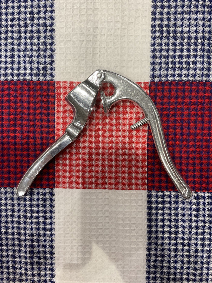 Roger Orfèvre 2-in-1 garlic crusher and olive/cherry pitter