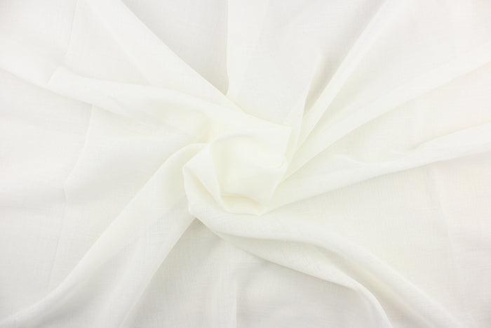 A sheer fabric  in a off white .