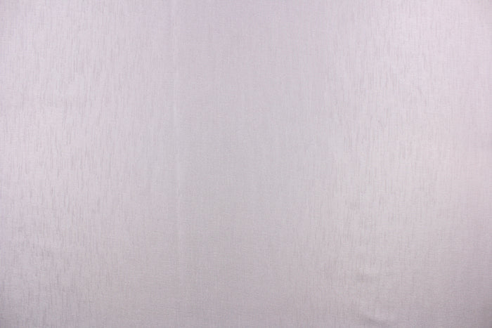This sheer fabric in a solid lavender.