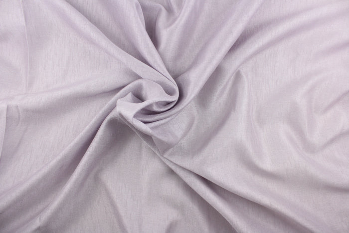 This sheer fabric in a solid lavender.