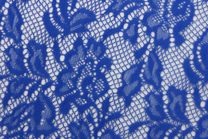 This lace features a floral design in a rich royal blue with a stretch.