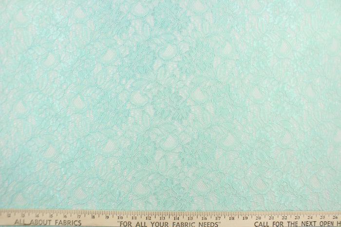 This lace features a floral design in a beautiful mint green with a stretch.