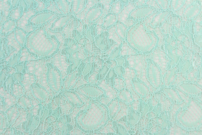 This lace features a floral design in a beautiful mint green with a stretch.