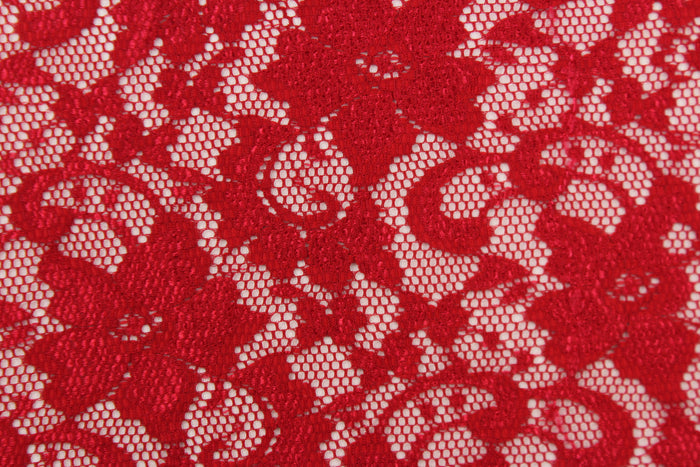 This lace features a floral design in a rich red with a stretch.