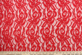 This lace features a floral design in a beautiful red tone  with a stretch.