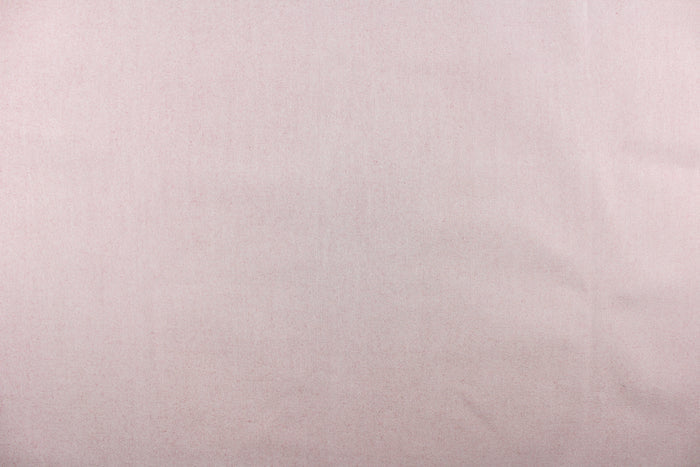 This fabric in a solid light color with hits of a rust red color is great for umbrellas, outdoor upholstery and more.