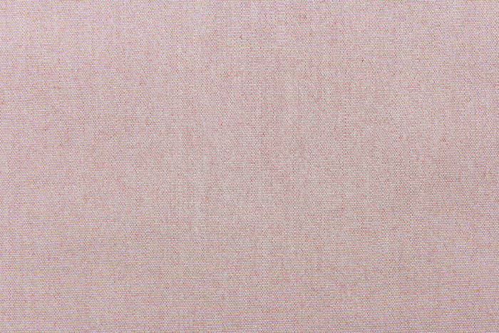 This fabric in a solid light color with hits of a rust red color is great for umbrellas, outdoor upholstery and more.