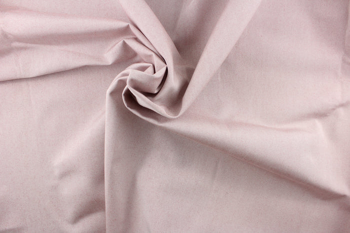 This fabric in a solid light color with hits of a rust red color is great for umbrellas, outdoor upholstery and more.