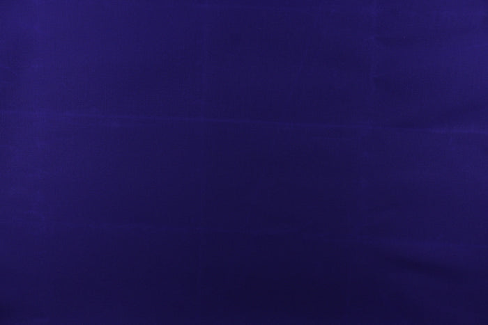 This fabric in a solid royal purple  color is great for umbrellas, outdoor upholstery and more.