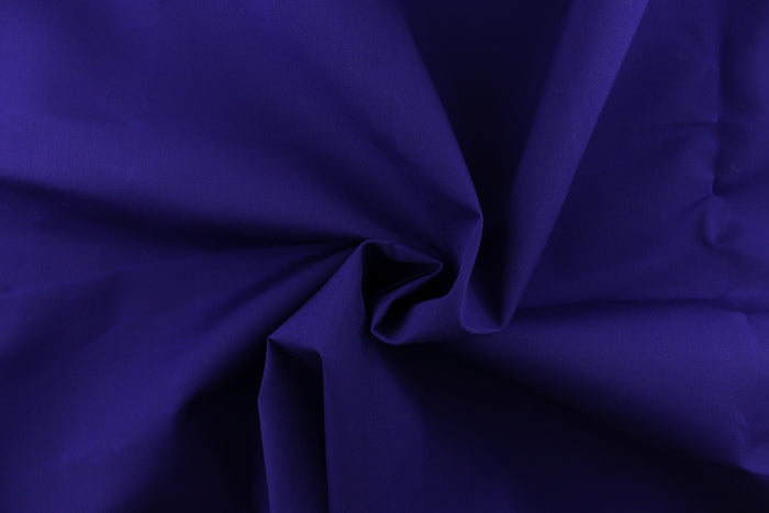 This fabric in a solid royal purple  color is great for umbrellas, outdoor upholstery and more.