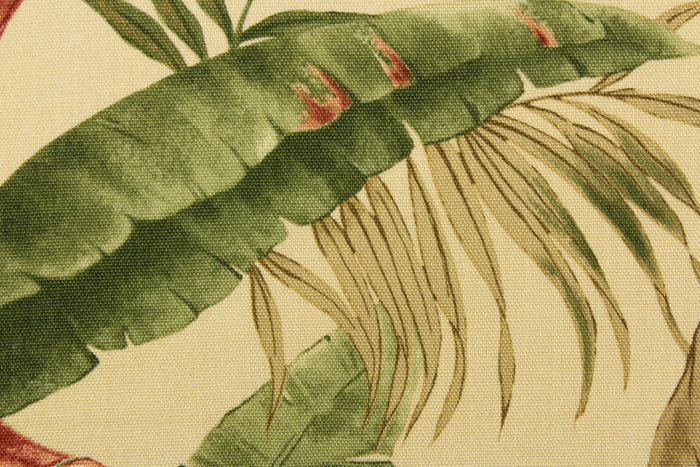 This fabric features a floral design of tropical leaves in green, brown, and rust red against a khaki color.