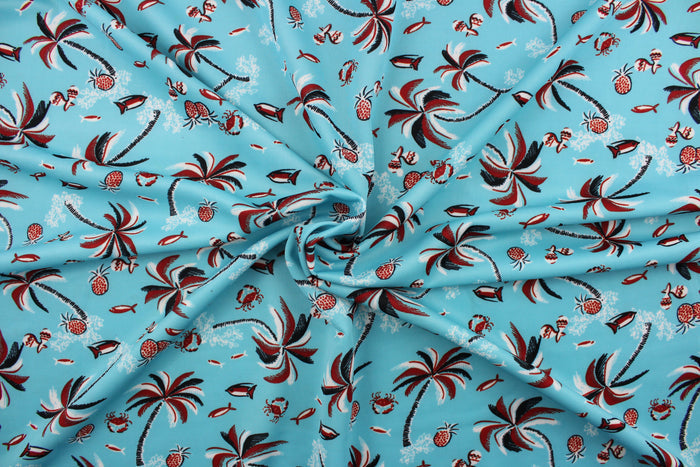 This fabric  has a tropical theme featuring palm trees, fish and fruit in red, black and white against a light blue background.  It is durable and breathable and will allow movements of the body.  Uses include dance and sports wear, leotards and dresses.  We offer several different lycra fabrics.