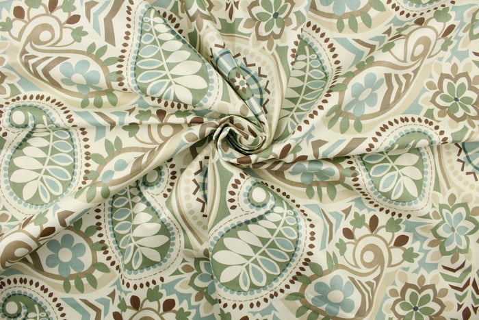 This fabric features a paisley floral design in light blue, moss green, brown, taupe, and pale beige set against a off white.