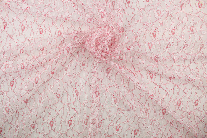 This lace features a woven floral design in white with red outline.