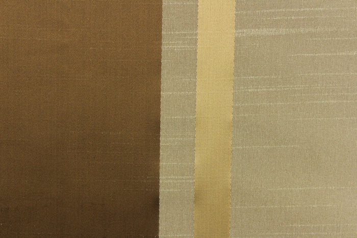 This stunning yarn dyed fabric features a  striped pattern in rich brown tones, gold and taupe.